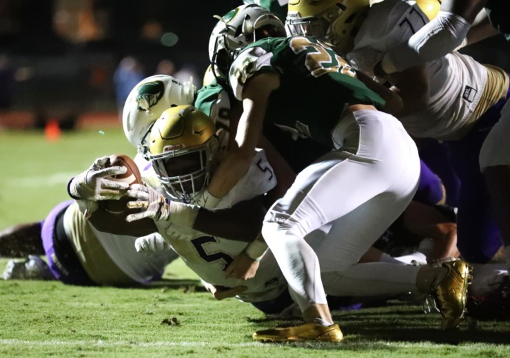 <strong>CBHS running back and linebacker Al Wooten lunges through a Briarcrest defense toward the end zone on Sept. 28, 2018.</strong> (Daily Memphian file)