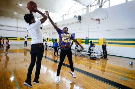 <strong>Chris Said, 15 (left), and Isiah Palm, 17 (right), play a pickup basketball game Sept. 11 during a dedication ceremony for the new community gym at MLK College Prep High School in Frayser.</strong> (Mark Weber/Daily Memphian)